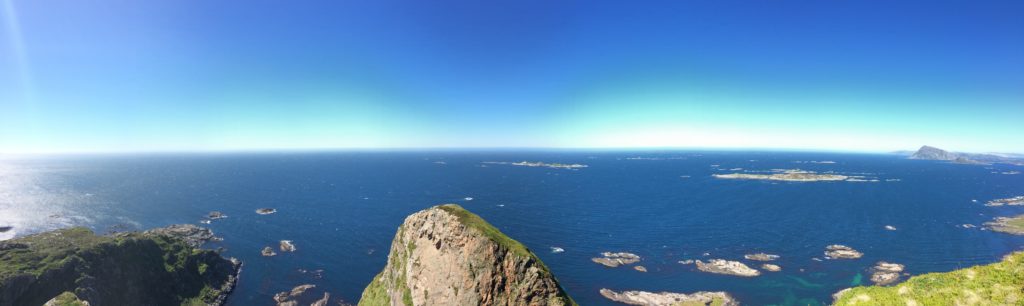 Looking westward from the top of Søre Stauren, the southern peak of Kinnaklova (the point at center is the pointed peak to the right in the images above). Furet, værbitt over vannet.